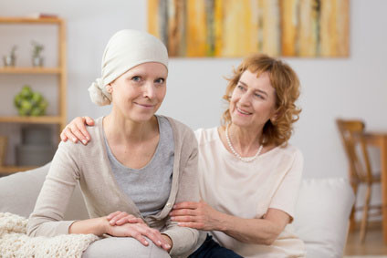 Cancer survivor sitting on couch breast, cancer, survivor, headscarf, couch, sitting, friend, chemotherapy, treatment, tumour, bald, struggle, fighting, sickness chemo, hope, oncology, disease, determination, support, family, health, care, people, strength, faith, friendship, medication, ill, courage, women, mother, daughter, sister, interior, patient, painting, victim, necklace, indoors, blurred, background